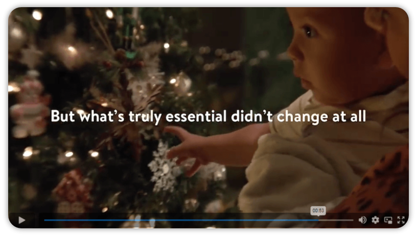 baby next to christmas tree.