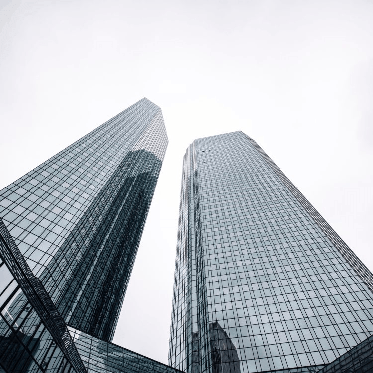 Two skyscrapers standing next to each other.