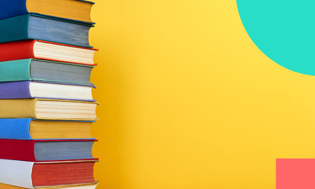 pile of books on yellow background.