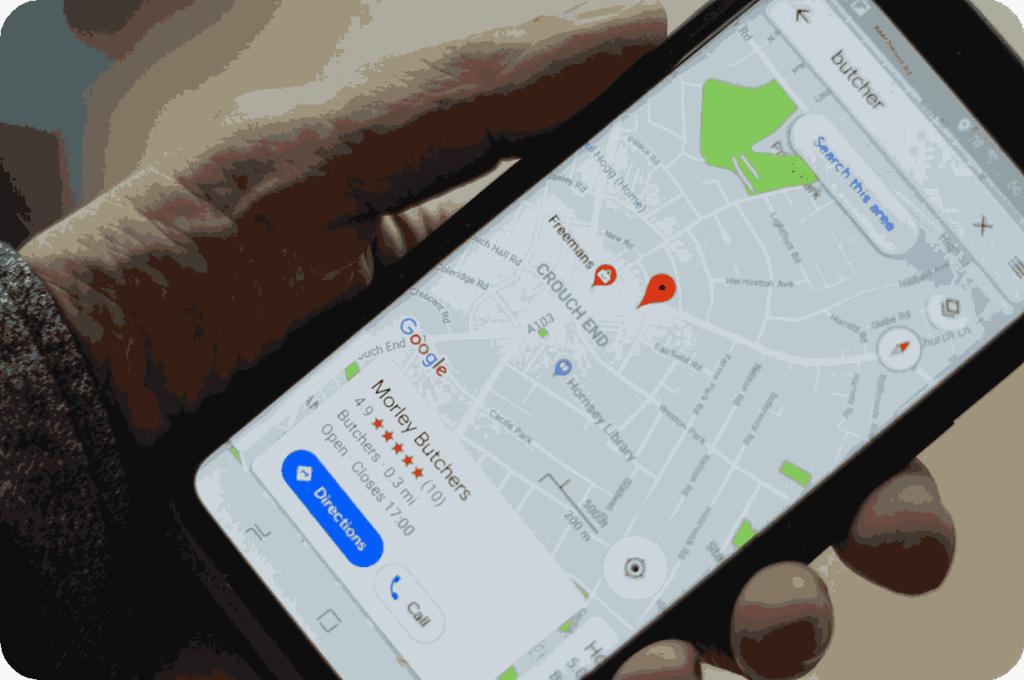 A smartphone showing Google Maps with a pinned location for a butcher shop.